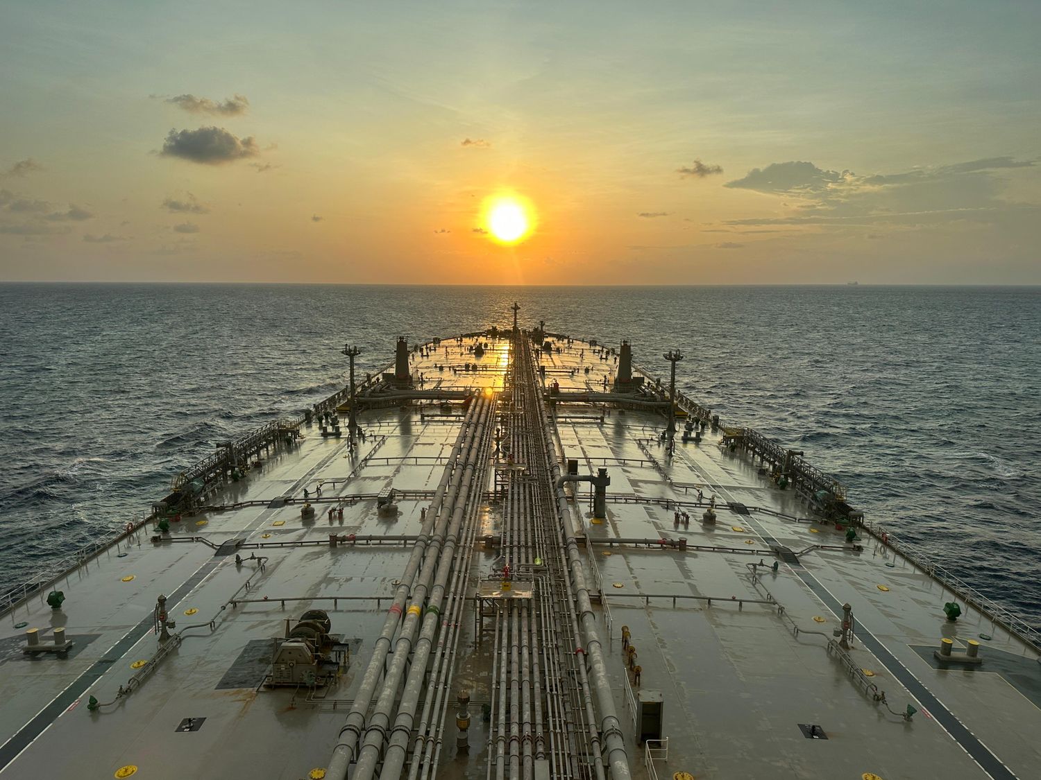 oil tanker at sea during sunset