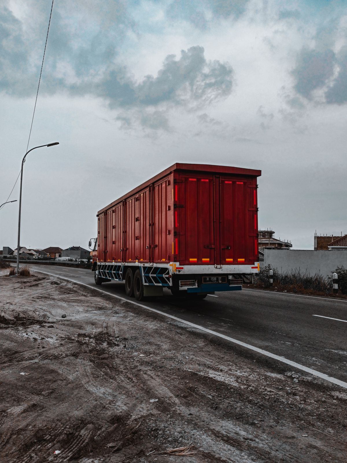Container truck transporting cargo by road