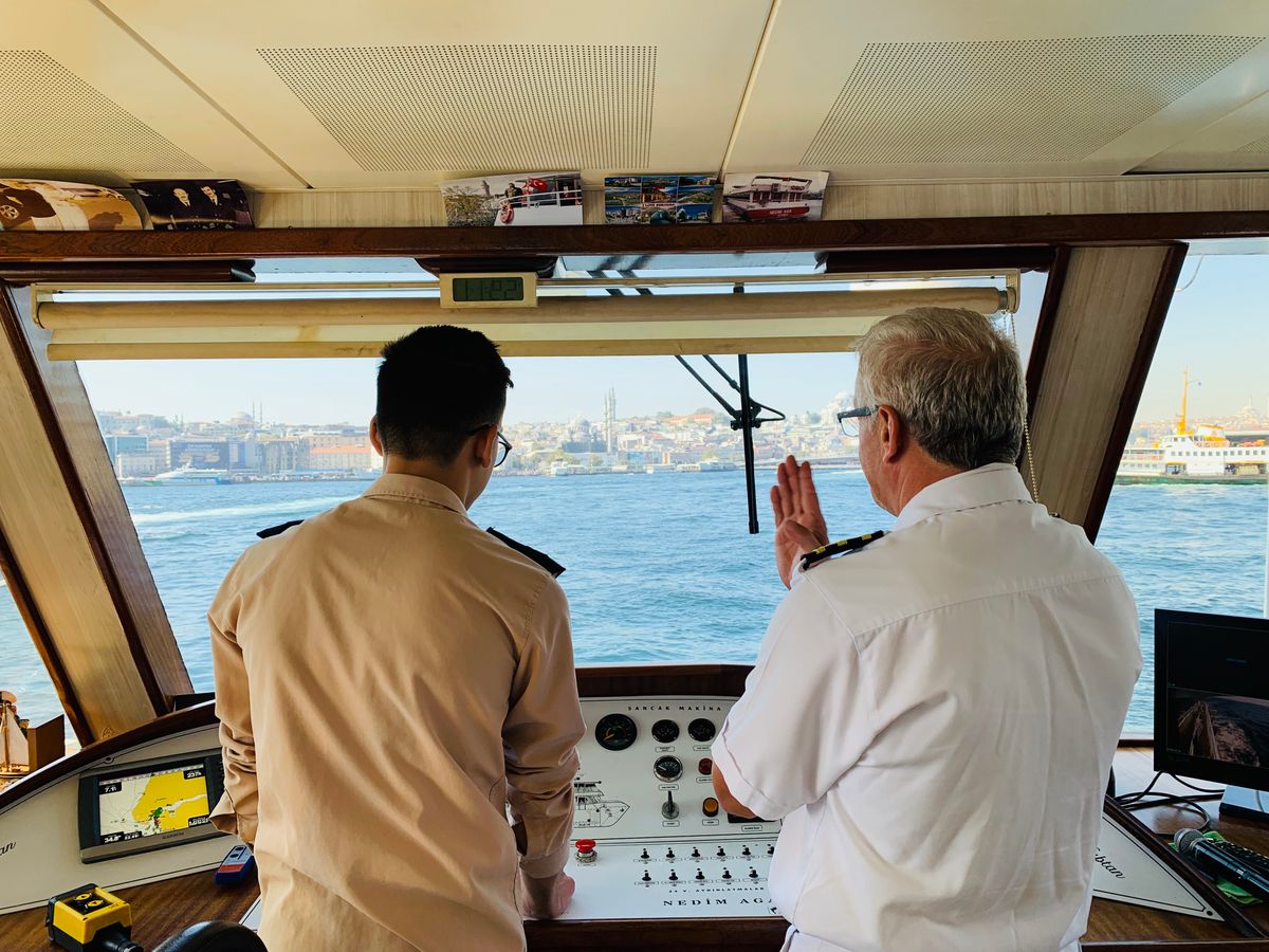 Captain and crew member discussing vessel navigation